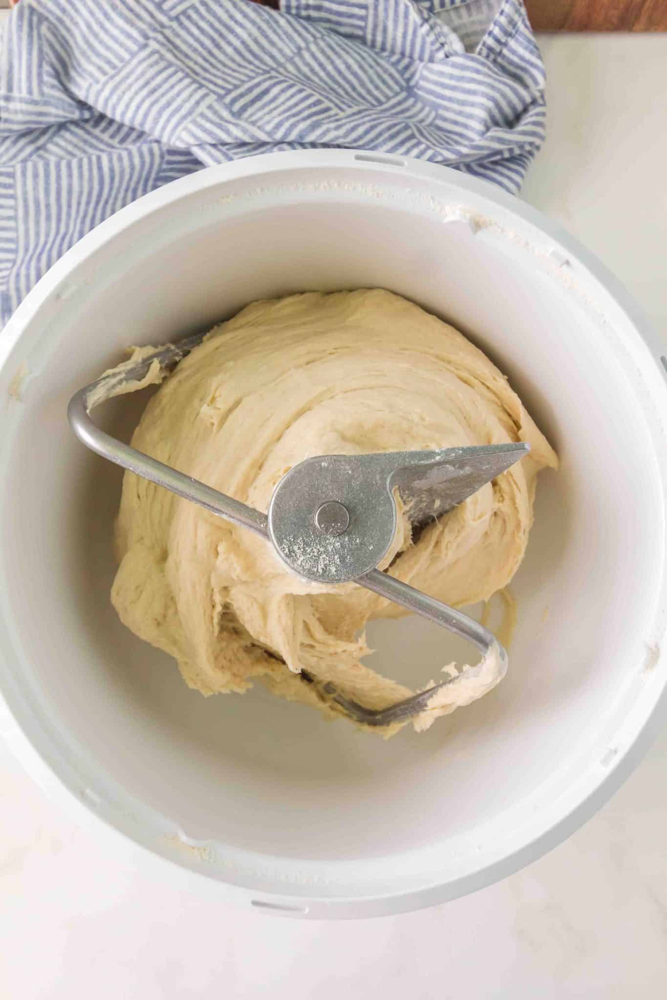 Bread dough that's been kneaded with a dough hook in a electric mixer - Hostess At Heart