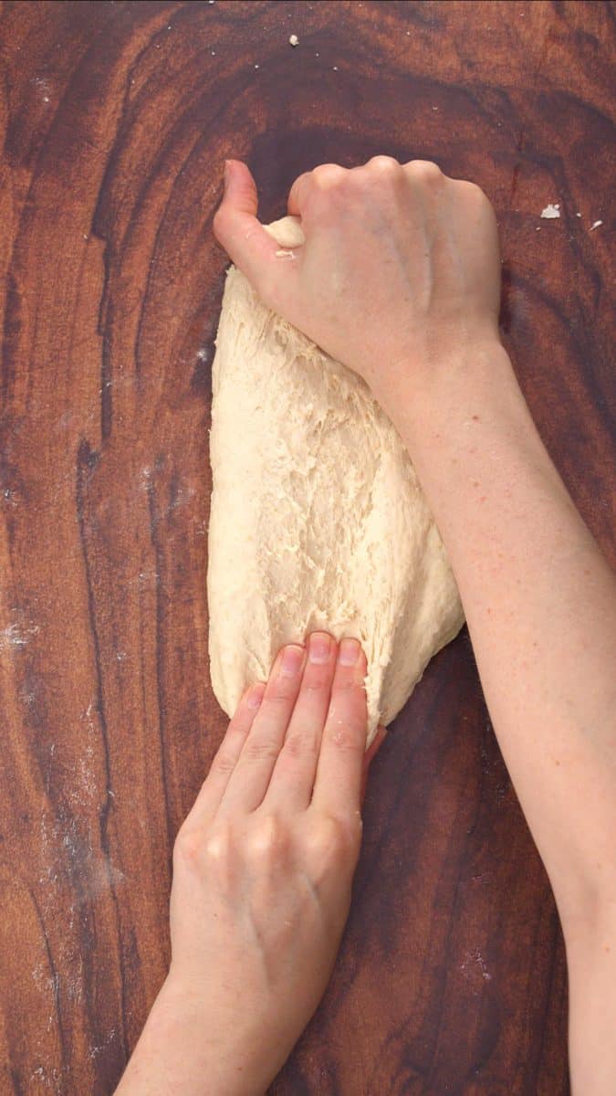 Two hands kneading bread dough - Hostess At Heart