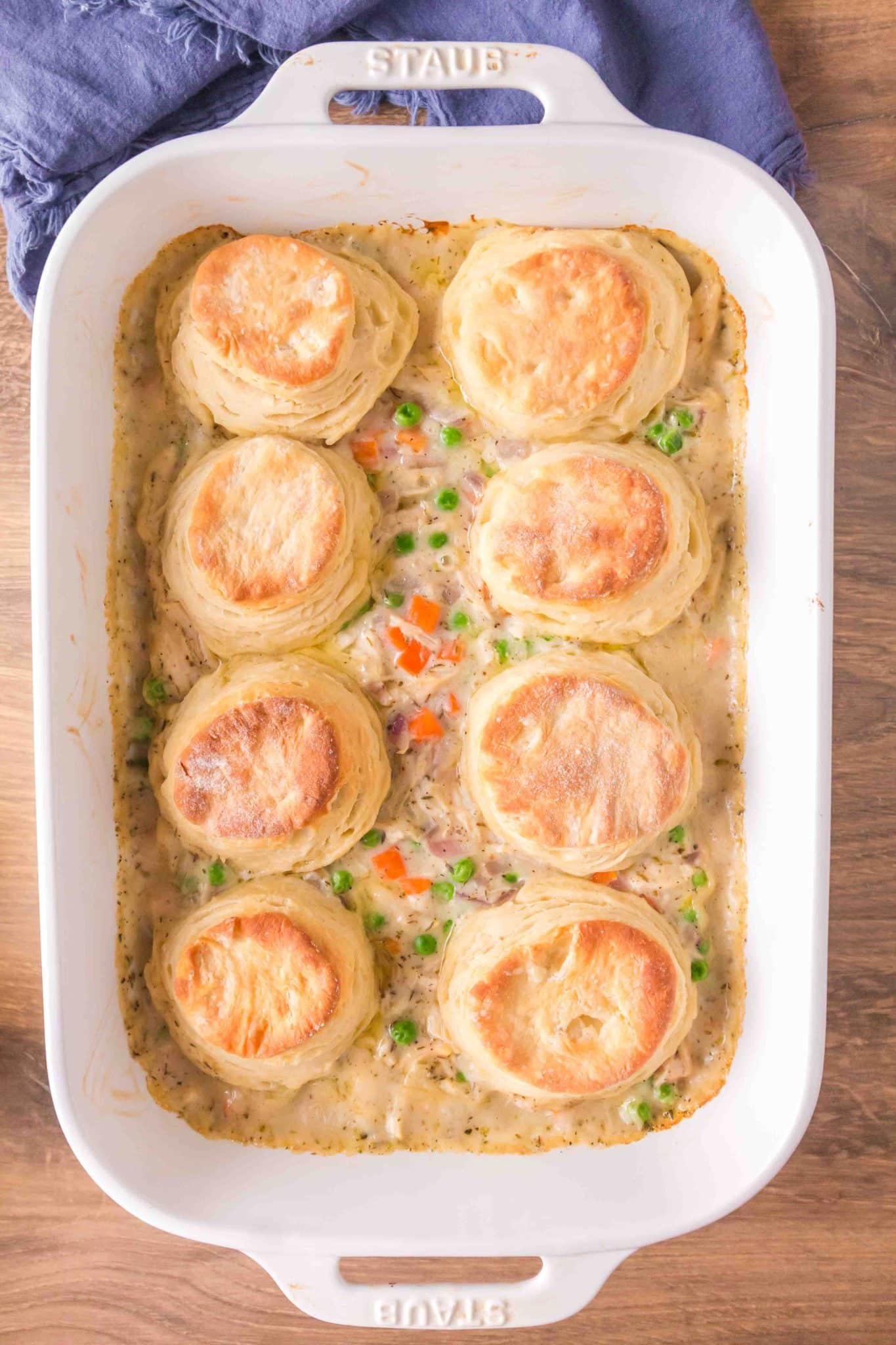 Top down view of a baking dish filled with chicken and biscuit casserole - Hostess At Heart