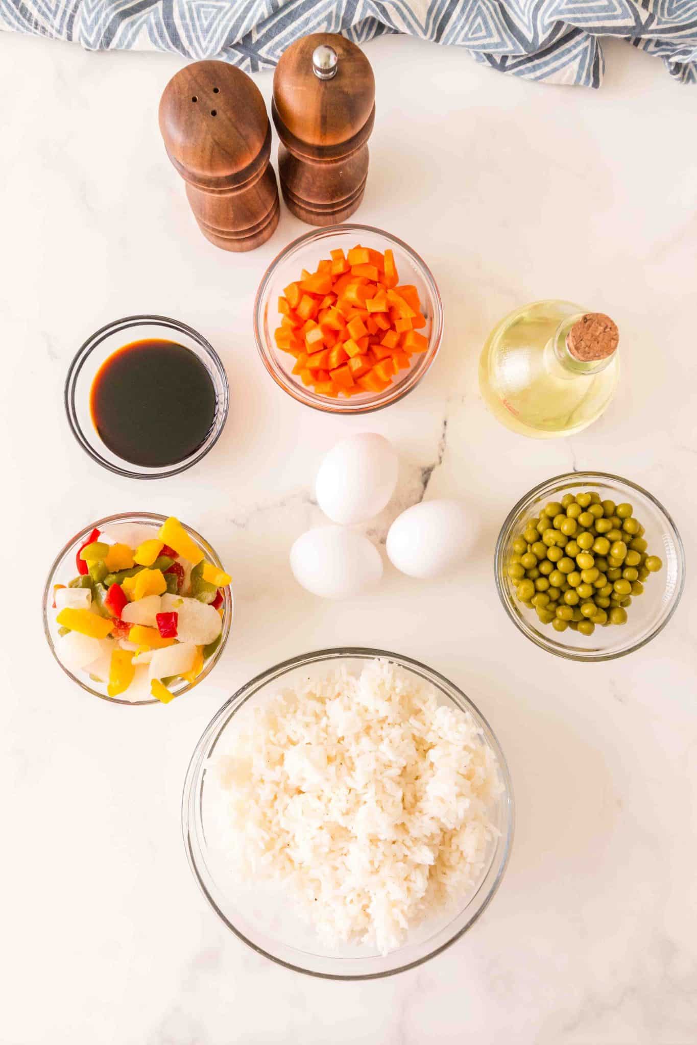 Fried rice ingredients including day old rice, vegetables, soy sauce eggs and oil. Hostess At Heart