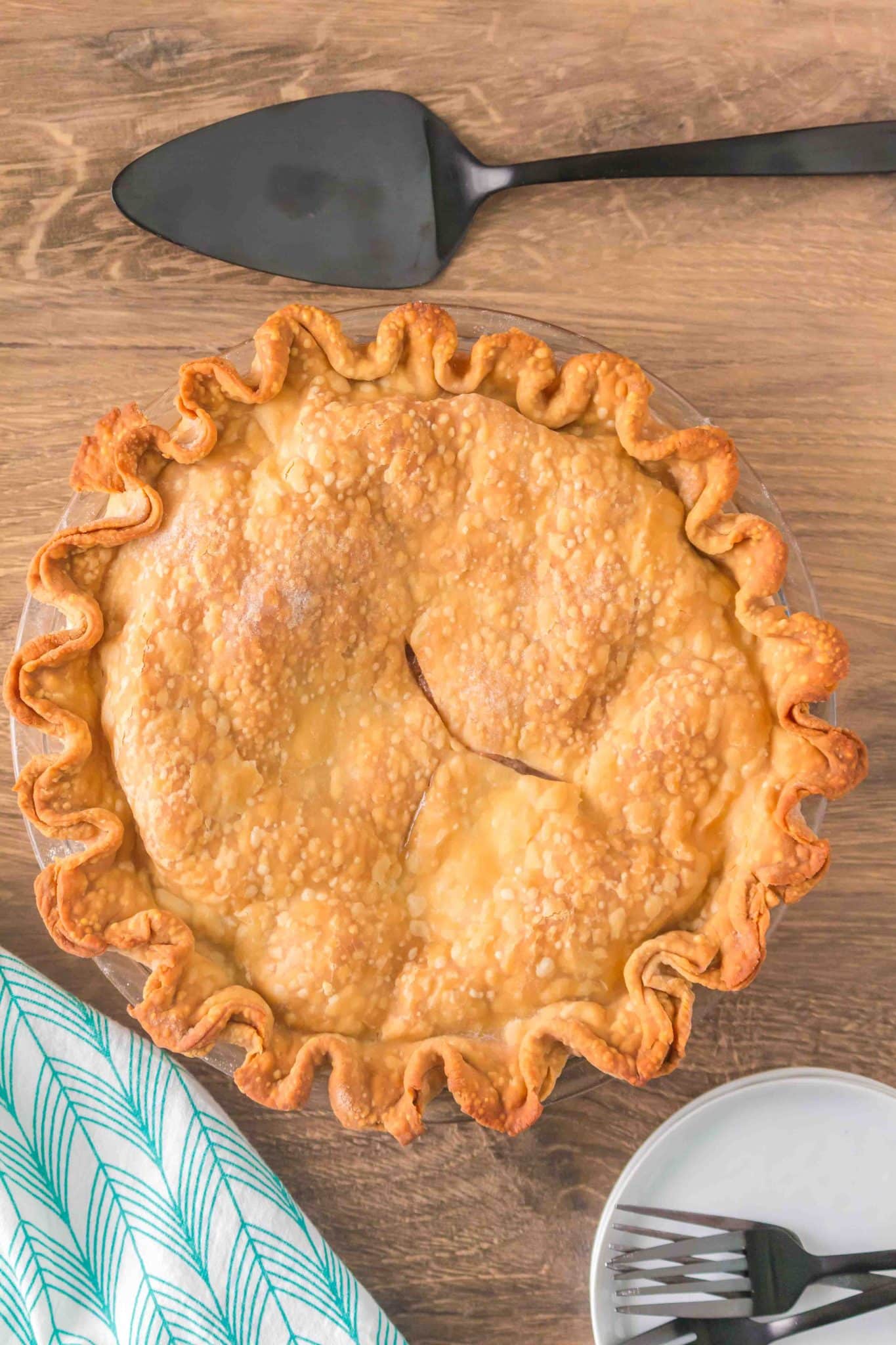 Top down view of a baked golden brown double crust pie - Hostess At Heart