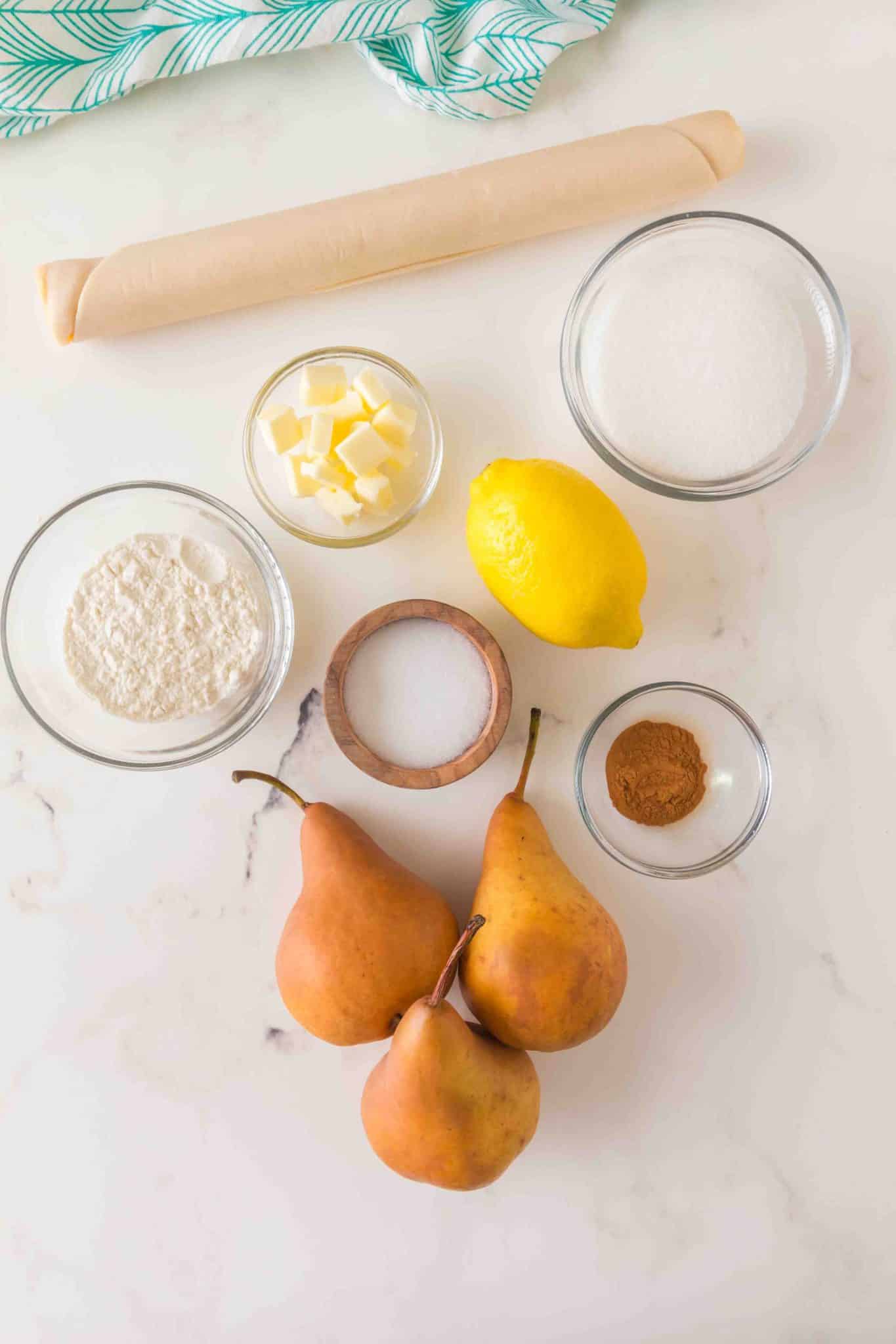 Pear Pie Ingredients: Rolled crust, anjou pears, butter, flour, sugar, cinnamon, salt, and lemon - Hostess At Heart