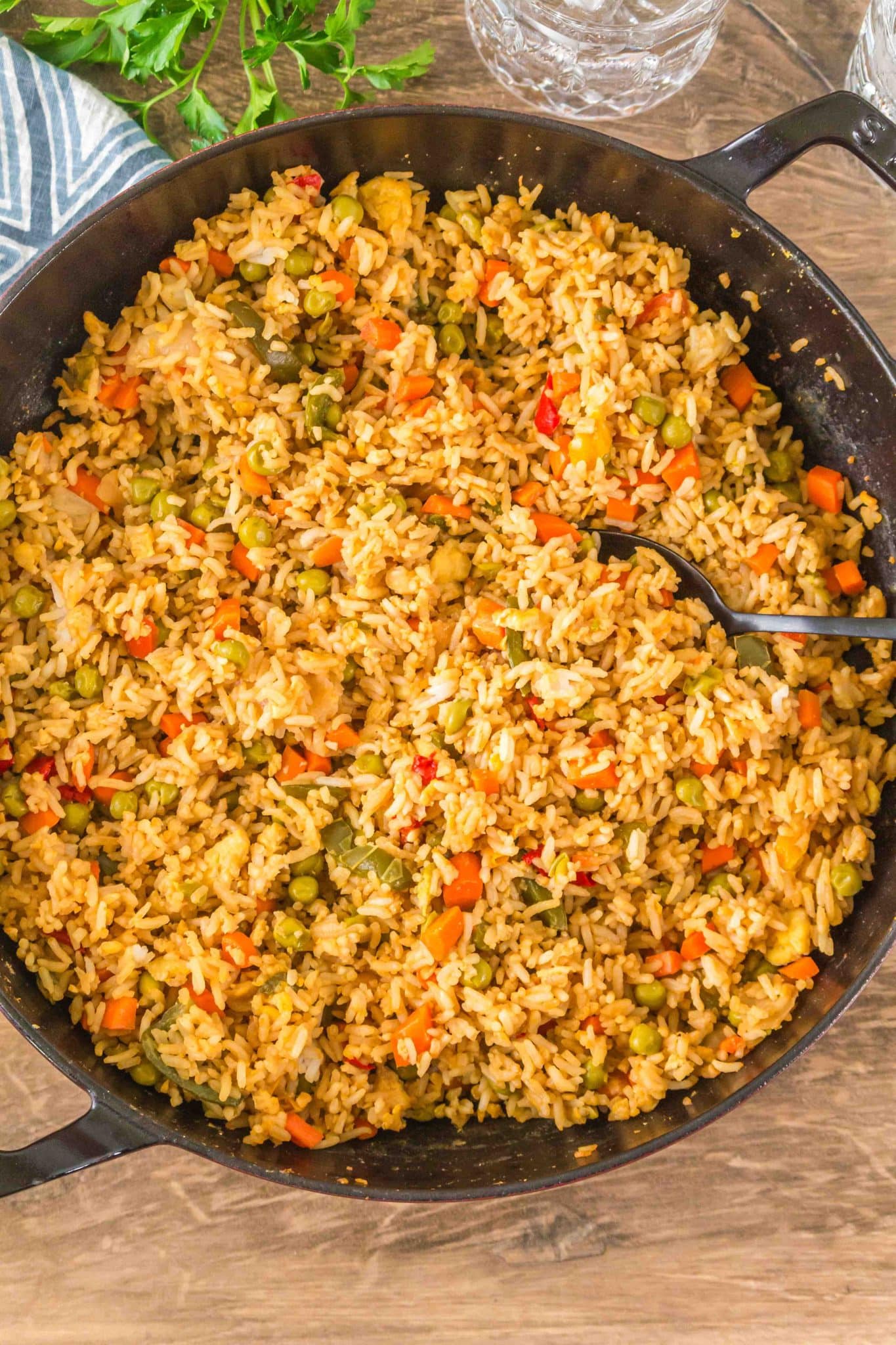 Top down view of a skillet filled with fried rice with egg - Hostess At Heart