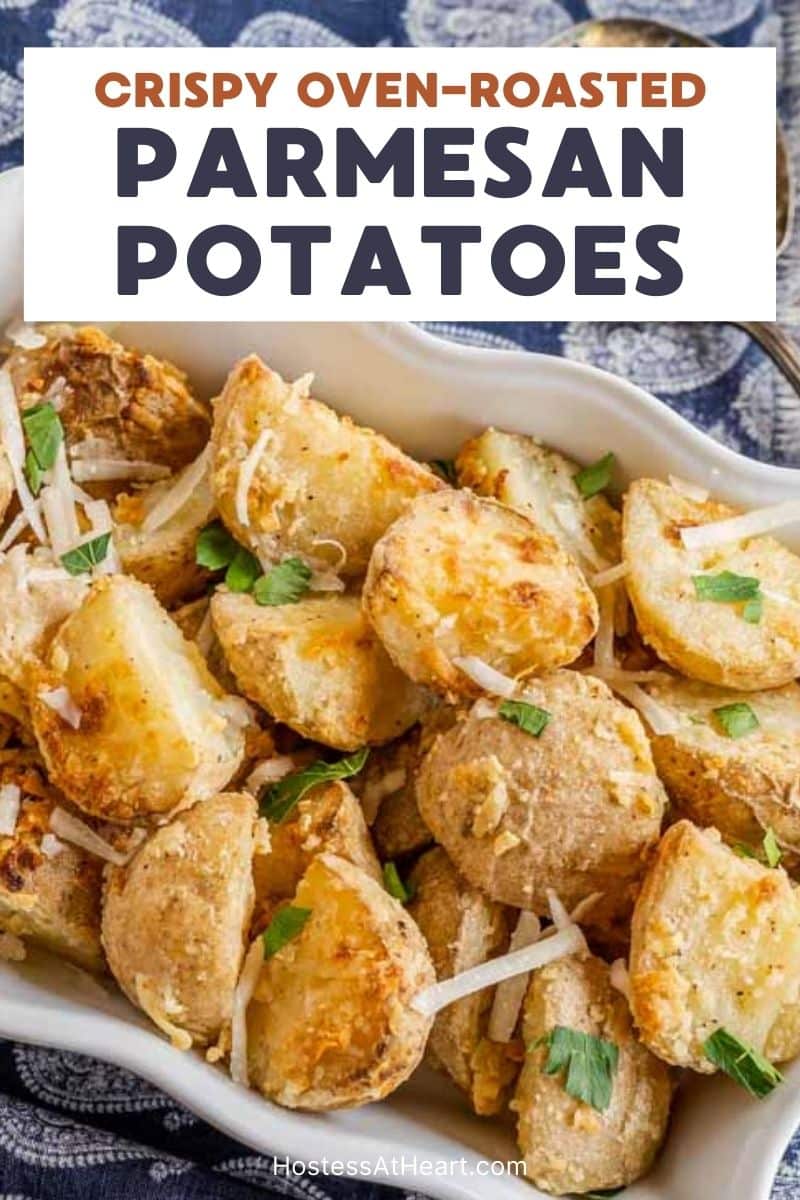 An image for Pinterest of Golden Brown Crispy Parmesan cheese roasted potatoes in a baking dish - Hostess At Heart