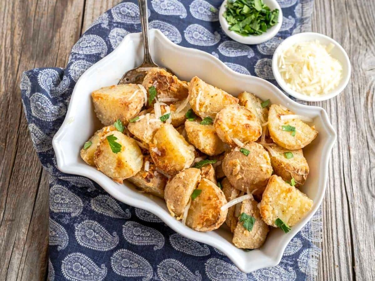 Top down view of crispy golden brown roasted parmesan potatoes - Hostess At Heart