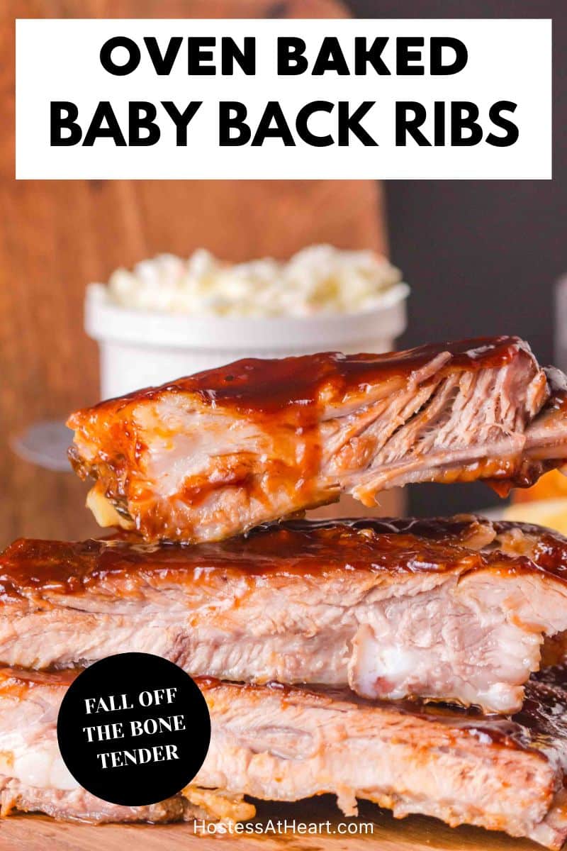 An image for Pinterest of a stack of oven baked baby back ribs covered in bbq sauce - Hostess At Heart