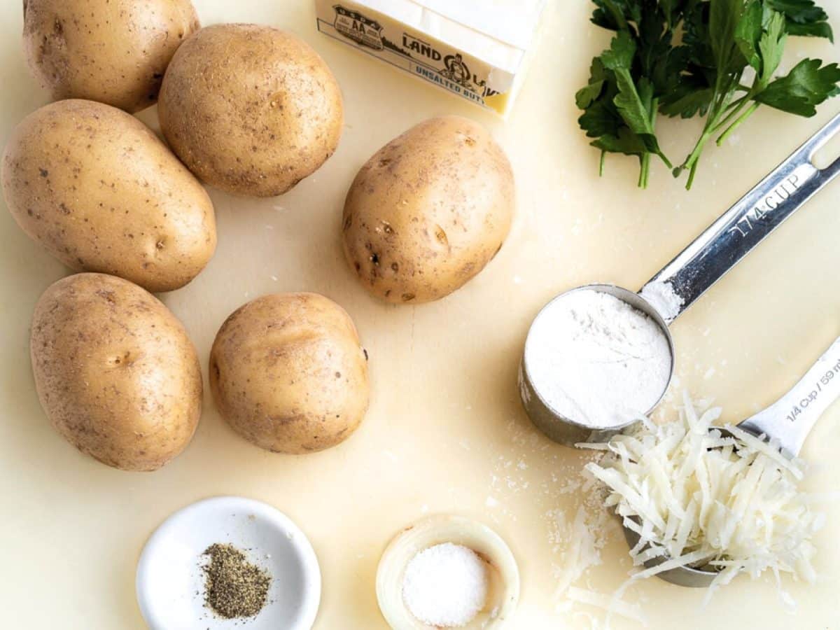 Ingredients: Yellow potatoes, parmesan cheese, butter, salt and pepper, flour and parsley - Hostess At Heart