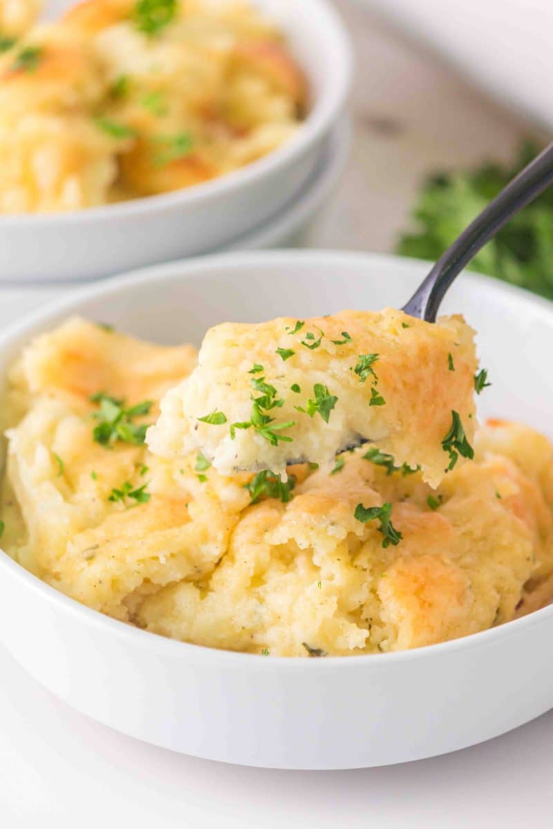 Sideview of a mashed potato recipe with Boursin and parmesan cheese - Hostess At Heart