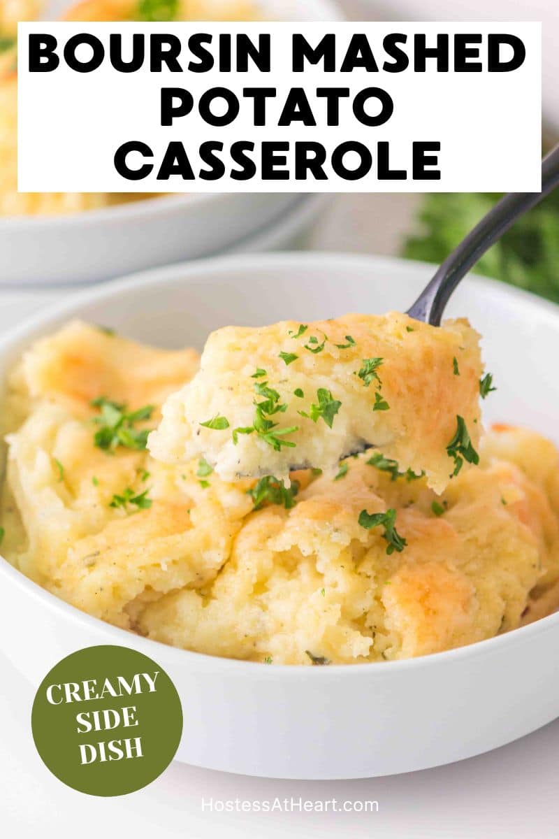 A titled image for Pinterest of a bowl of creamy Boursin Mashed Potatoes with a spoon hovering over the bowl showing how creamy it is- Hostess At Heart