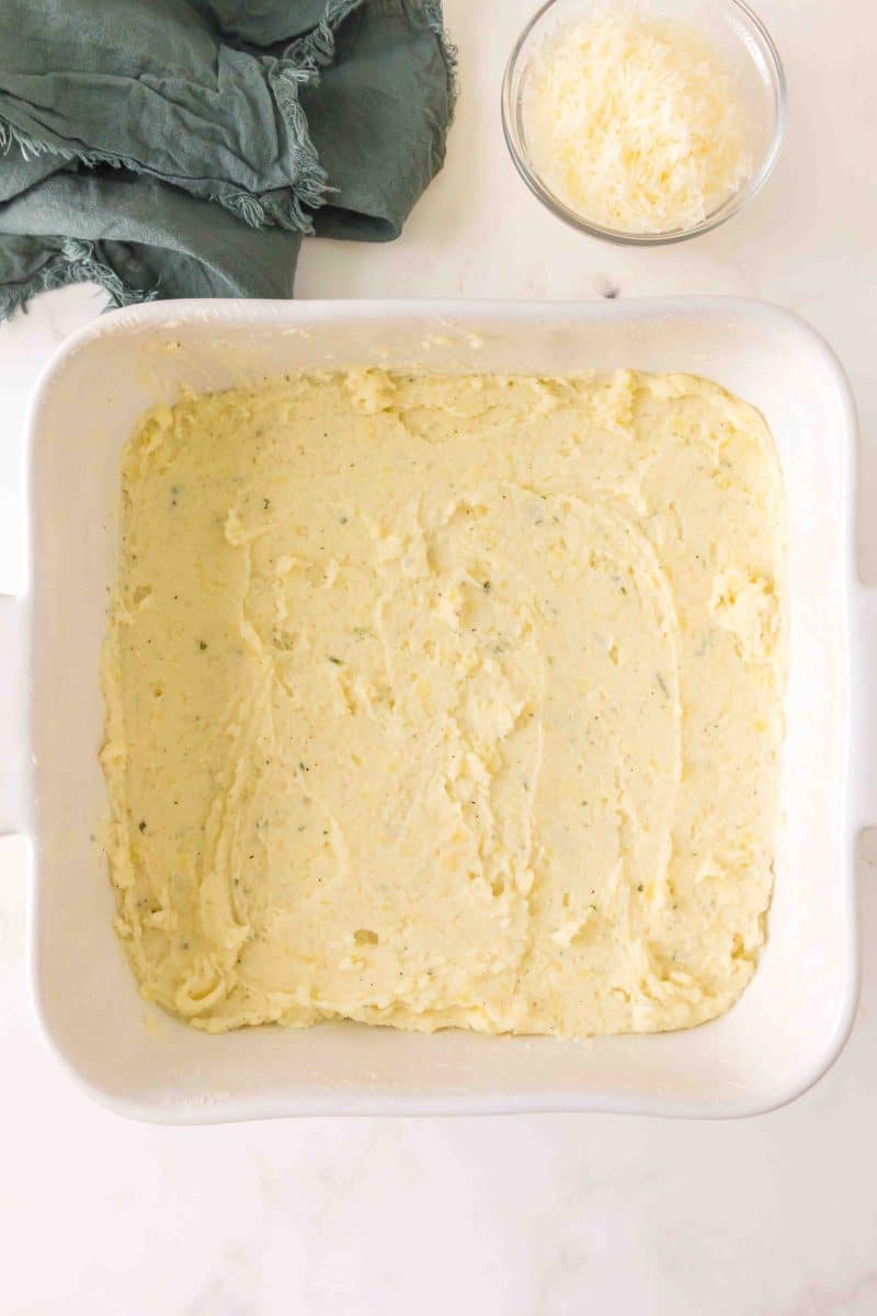 Top down view of a casserole dish filled with an unbaked mashed potato recipe - Hostess At Heart