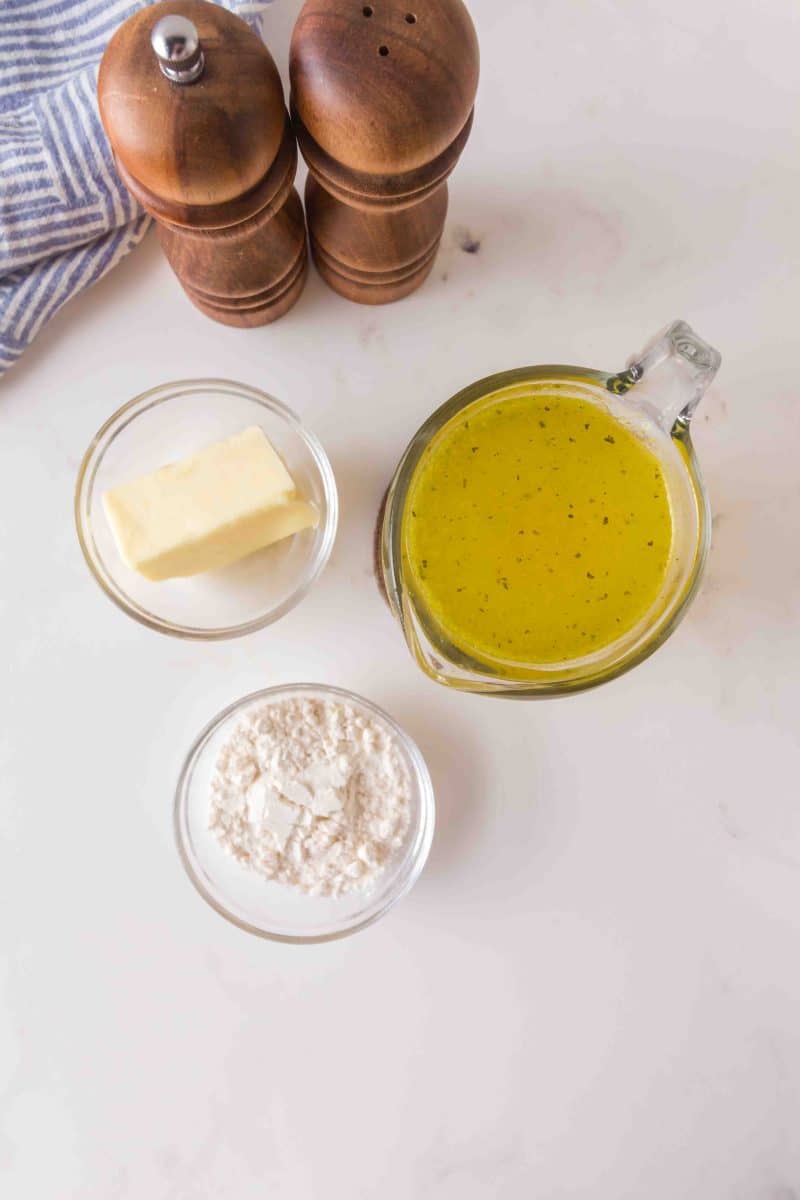 Ingredients to make chicken gravy: flour, butter, and chicken broth - Hostess At Heart