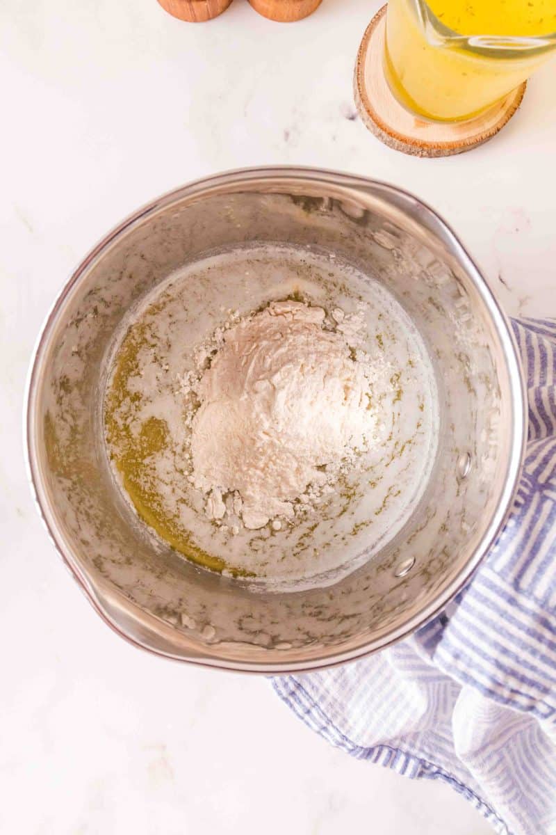 Flour added to melted butter in a pot - Hostess At Heart