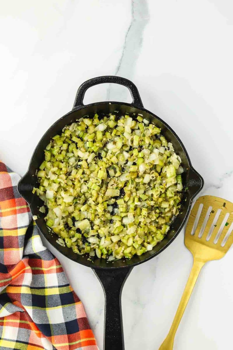 A skillet filled with sauted veggies and herbs - Hostess At Heart
