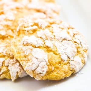 Close up view of lemon crinkle cookies lined up on a plate - Hostess At Heart