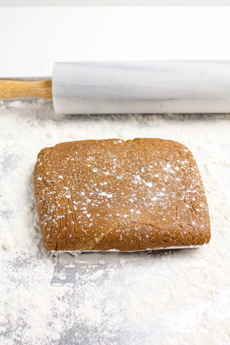 Chilled gingerbread cut out cookie dough on a working surface before rolling - Hostess at Heart