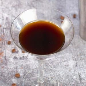 Chocolate espresso martini cocktail in a chilled martini glass with coffee beans - Hostess At Heart