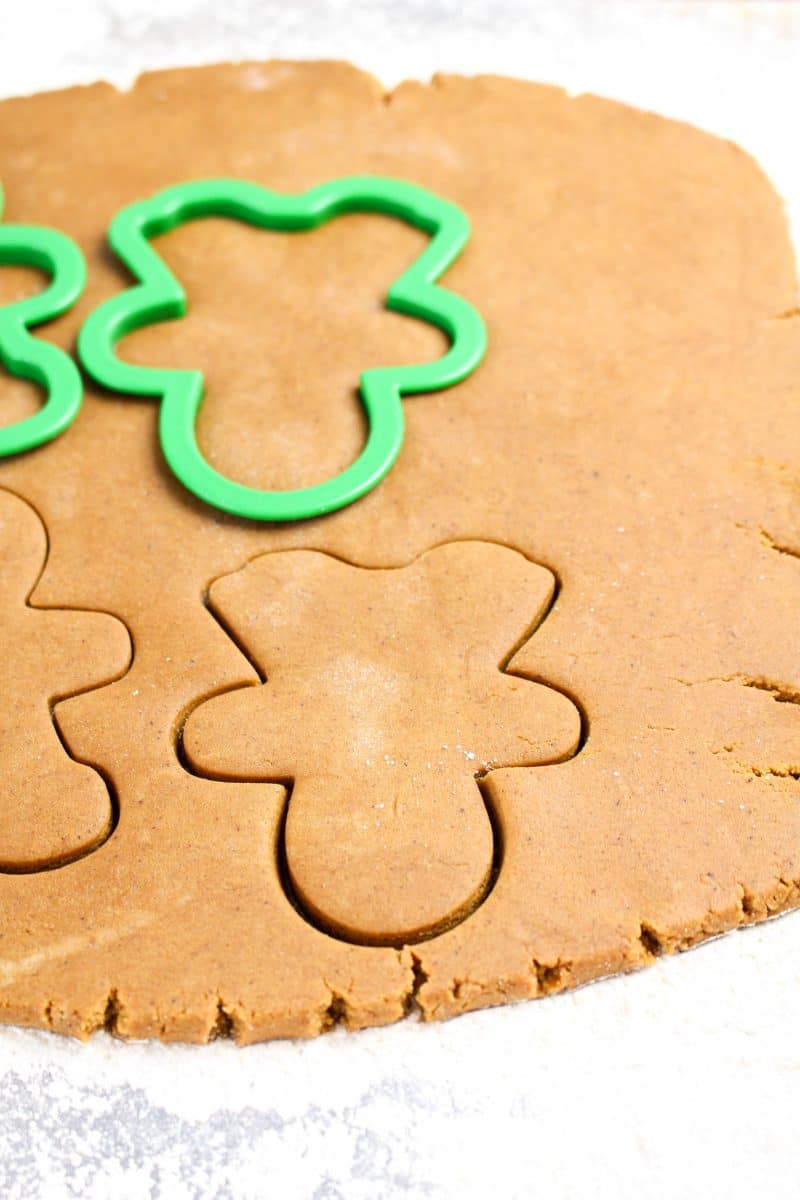 A cookie cutter pressed into rolled Gingerbread cut out dough - Hostess At Heart