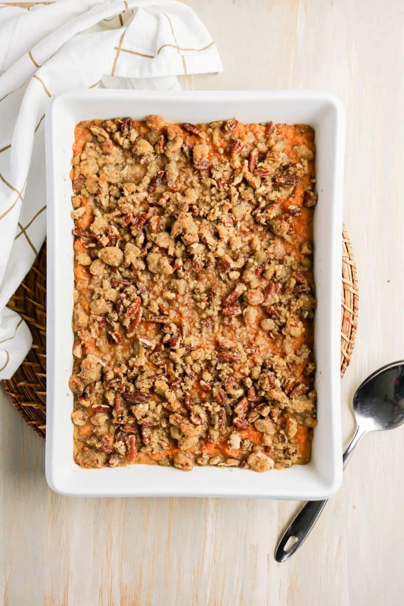 Baked sweet potato casserole with pecan topping fresh from the oven - Hostess At Heart