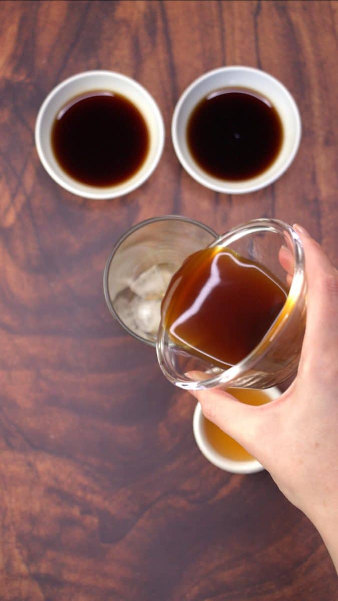 Pouring espresso over ice in order to chill it for a coffee cocktail - Hostess At Heart