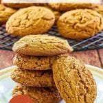 A Pinterest image of soft gingerbread cookies stacked on top of each other with a soft molasses cookie propped up on it's side. Hostess At Heart