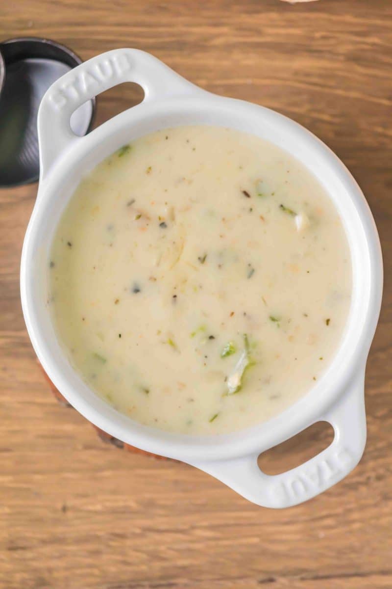 Top down view of a bowl filled with green chili clam chowder - Hostess At Heart