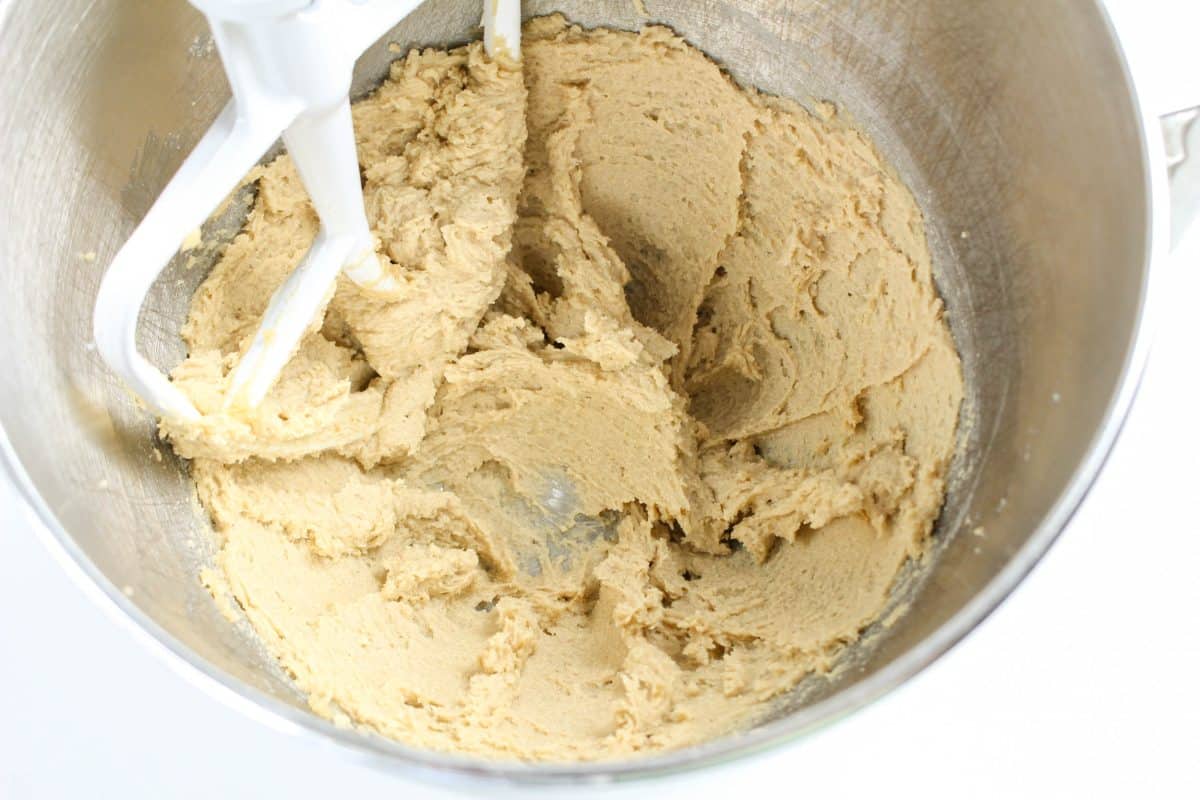 The bowl of an electric mixer filled with whipped brown sugar and butter until fluffy. Hostess At Heart
