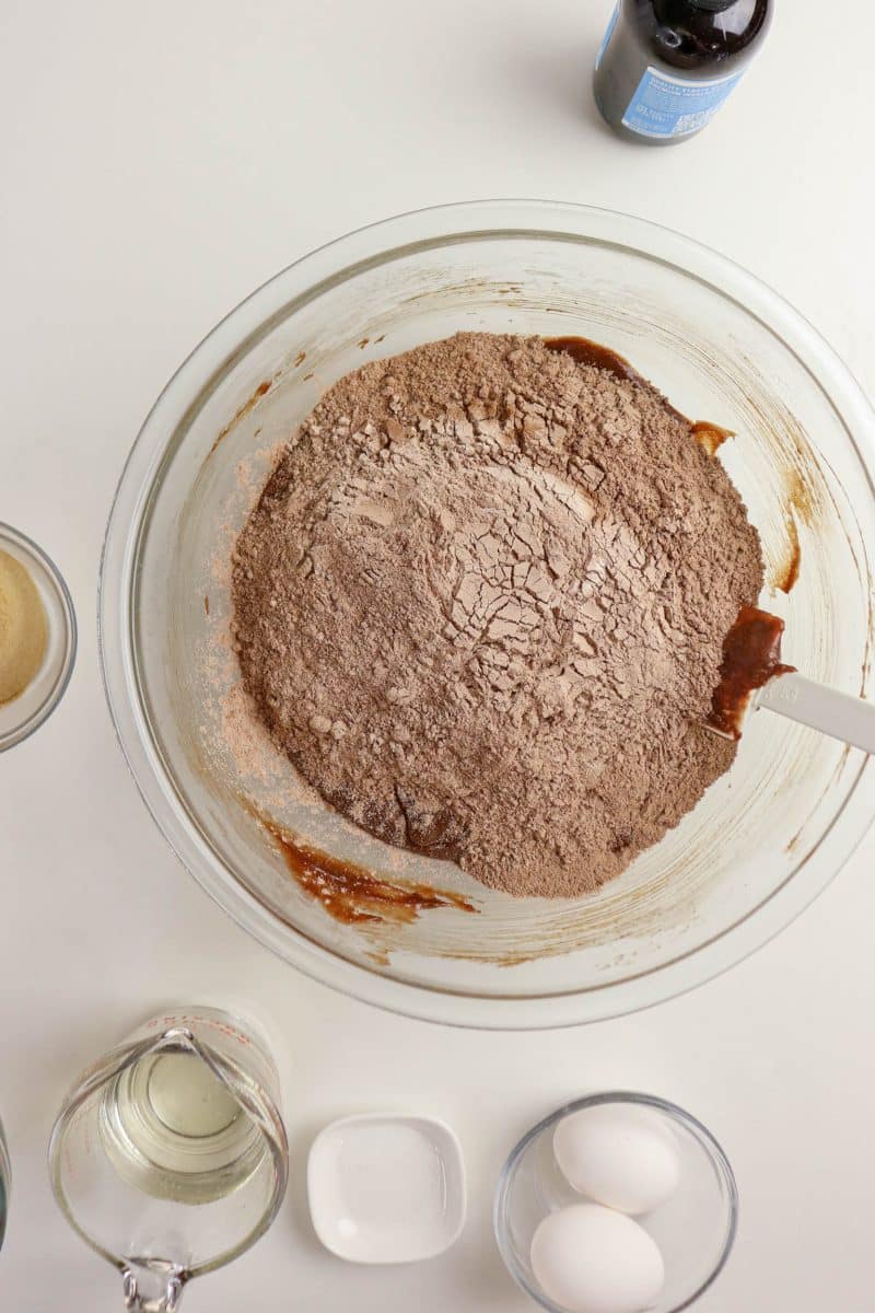 Adding sifted cocoa powder and flour into chocolate brownie mixture - Hostess At Heart