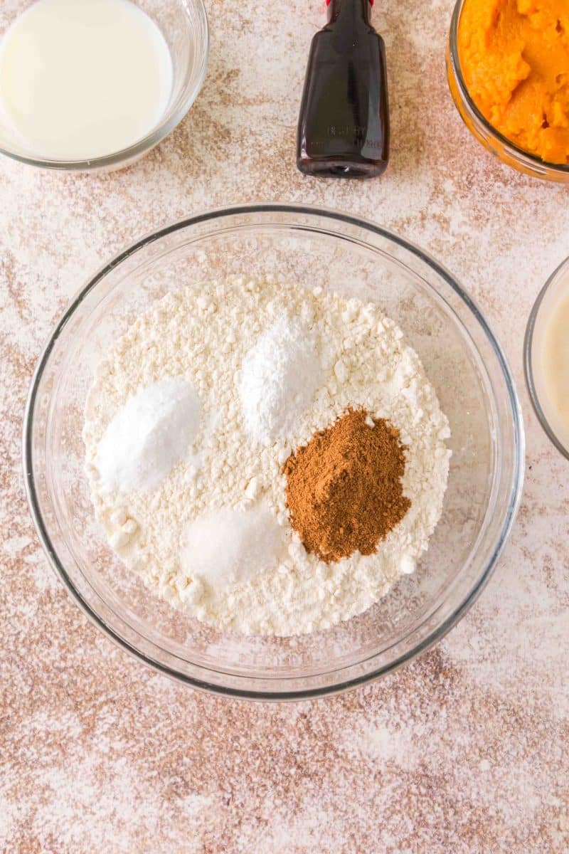 Combined together flour, pumpkin spice, baking powder, and baking soda in a large mixing bowl - Hostess At Heart