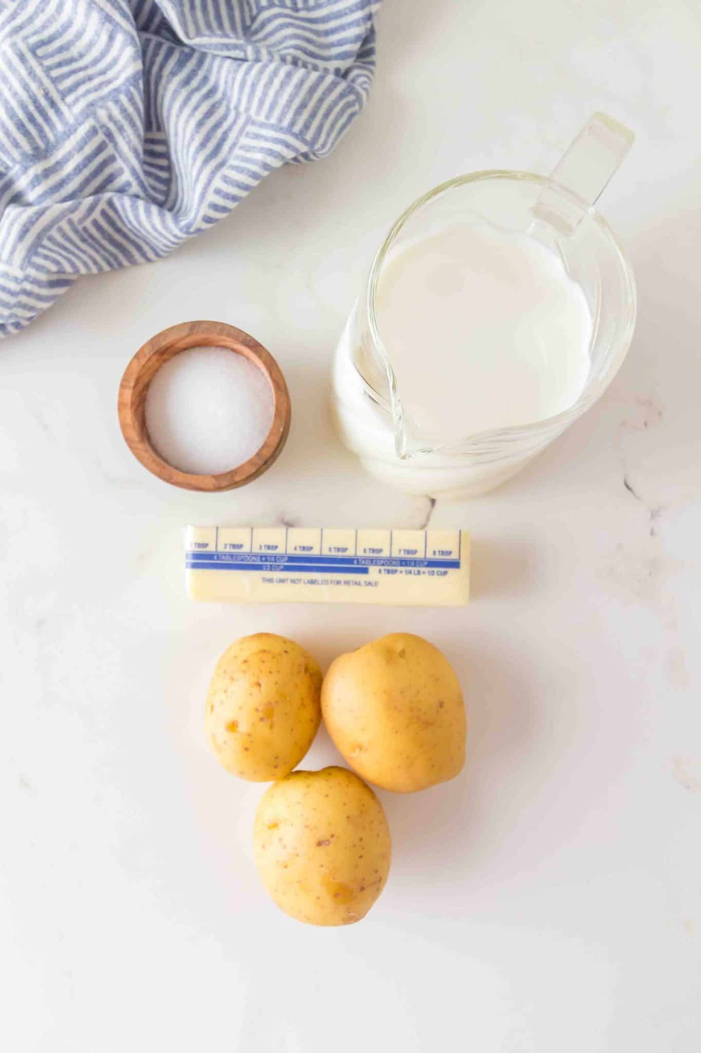 Ingredients for homemade mashed potatoes - Yukon Gold potatoes, butter, and milk - Hostess At Heart