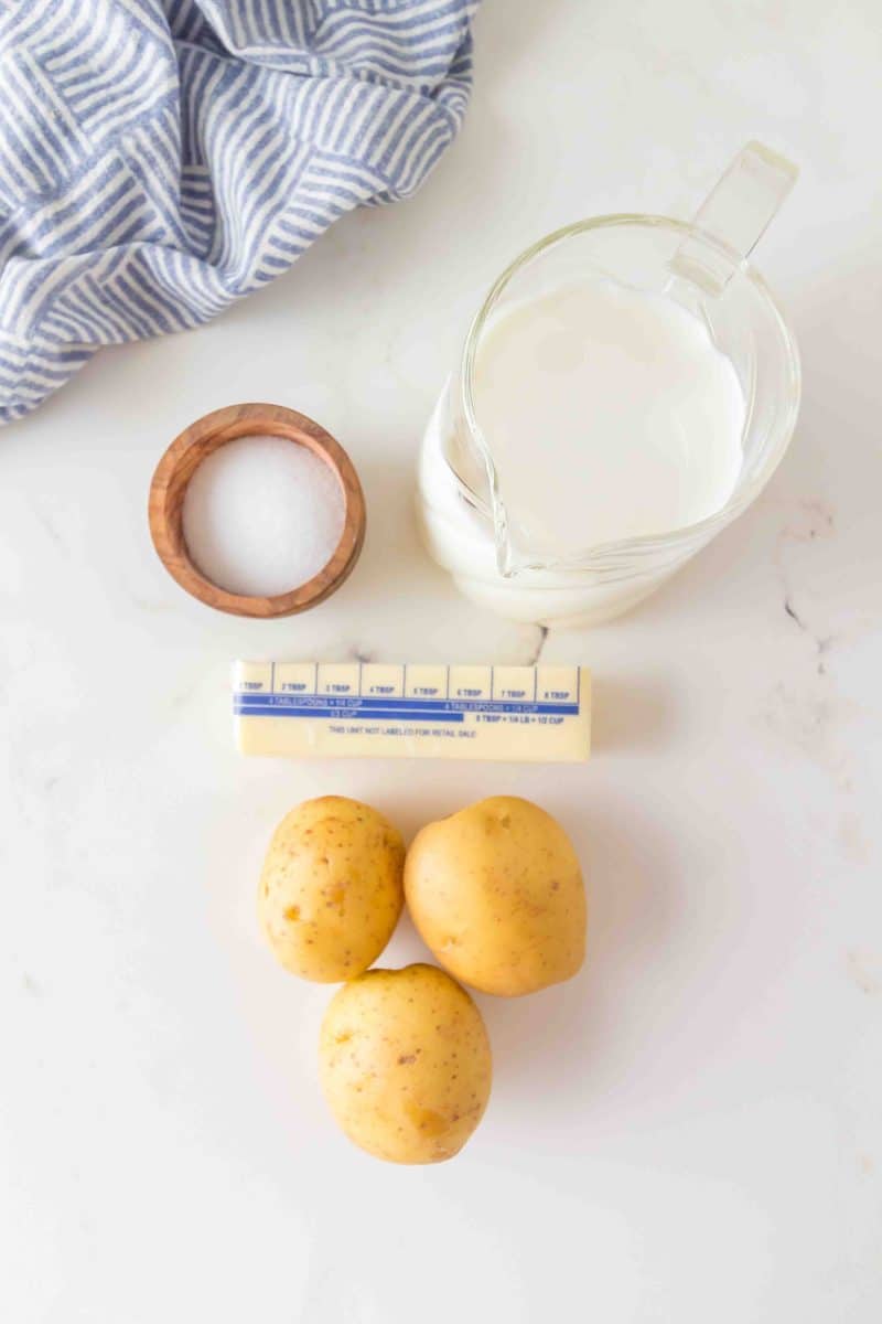 Ingredients for homemade mashed potatoes - Yukon Gold potatoes, butter, and milk - Hostess At Heart