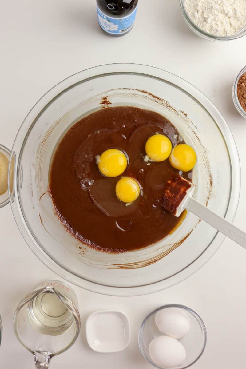 Eggs added to wet brownie batter mixture - Hostess At Heart