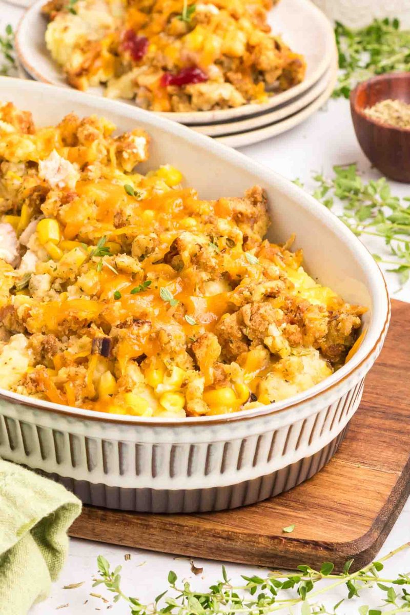 Thanksgiving Leftover Casserole in a baking dish baked golden brown and topped with melted cheese - Hostess At Heart