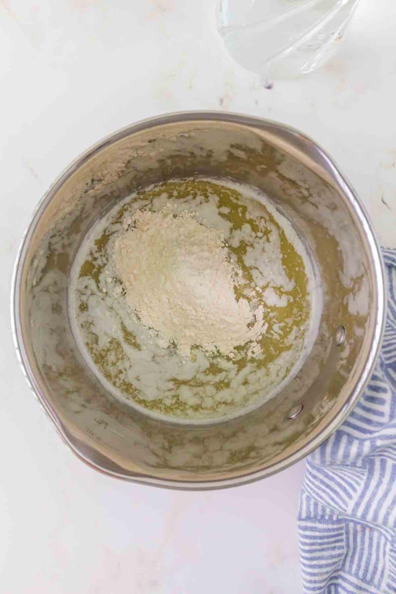Flour added to melted butter to make roux for beef broth gravy - Hostess At Heart