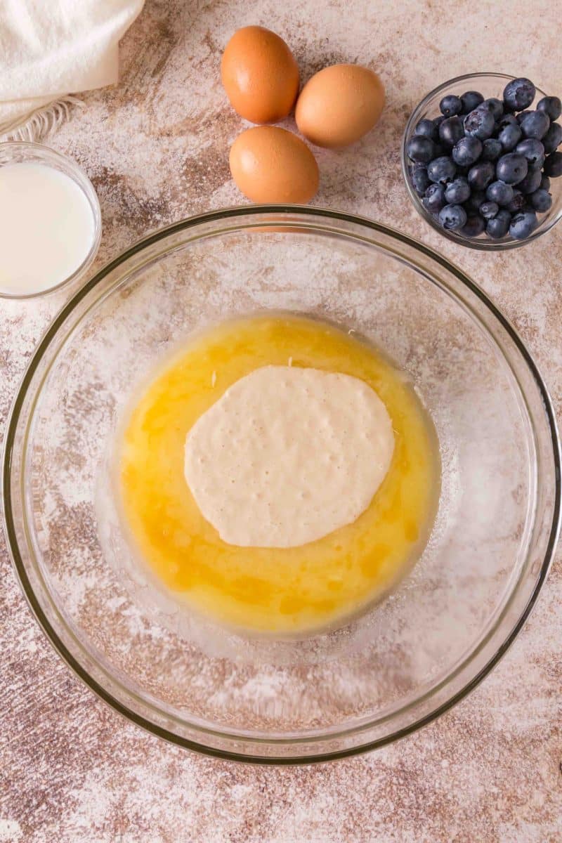 Adding sourdough discard to sugar mixture for blueberry lemon bread. Hostess At Heart