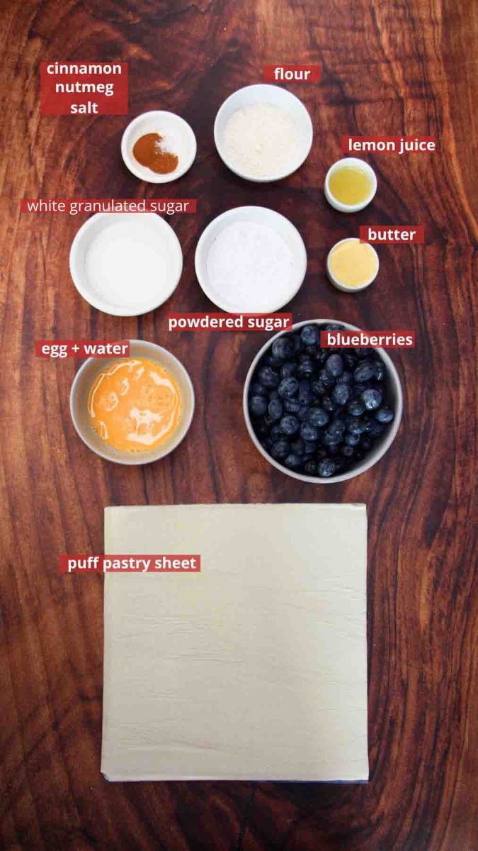 Puff Pastry Blueberry roll ingredients: Puff Pastry, blueberries, flour, sugar both white and powdered, cinnamon, nutmeg, salt, butter and lemon juice. Hostess At Heart