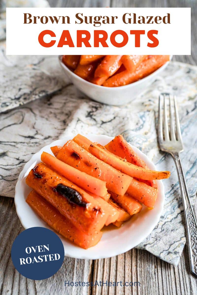 Brown sugar glazed carrots in a white serving dish with orange glaze