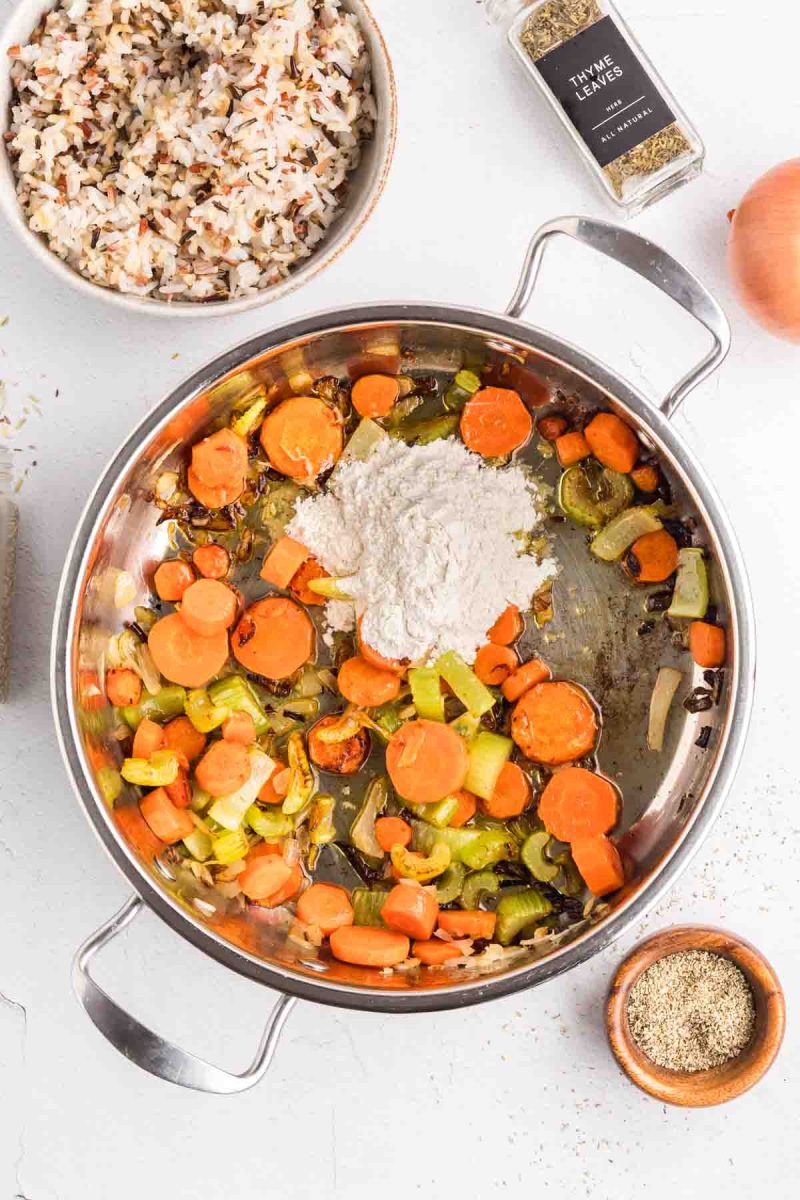 Flour added to colorful sauteed veggies in order to make a thick creamy sauce. Hostess At Heart