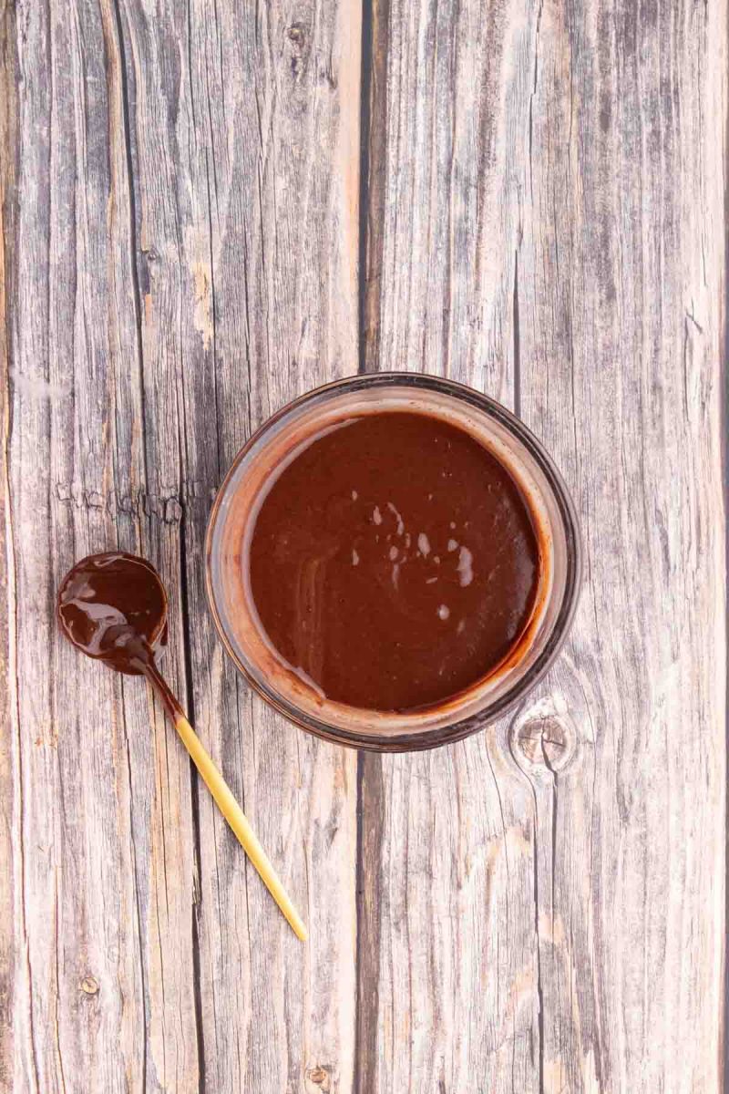 Top down view of a bowl of smooth and creamy chocolate ganache - Hostess At Heart