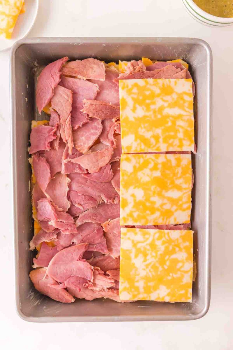 A second layer of cheese covering the previous layer of ham.