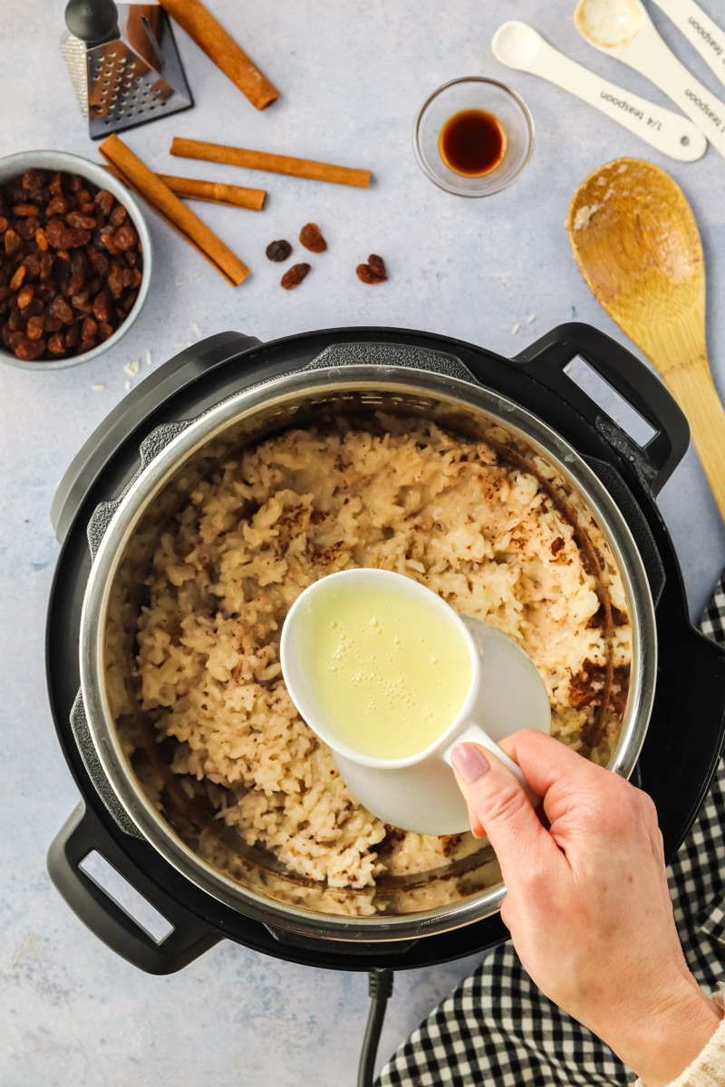 Sweetened Condensed Milk added to cooked rice in a Instant Pot - Hostess At Heart
