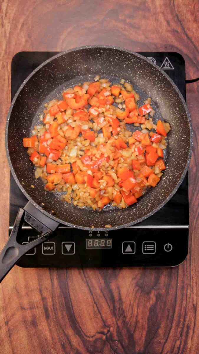 Red pepper and onion sauteed in a skillet. Hostess At Heart