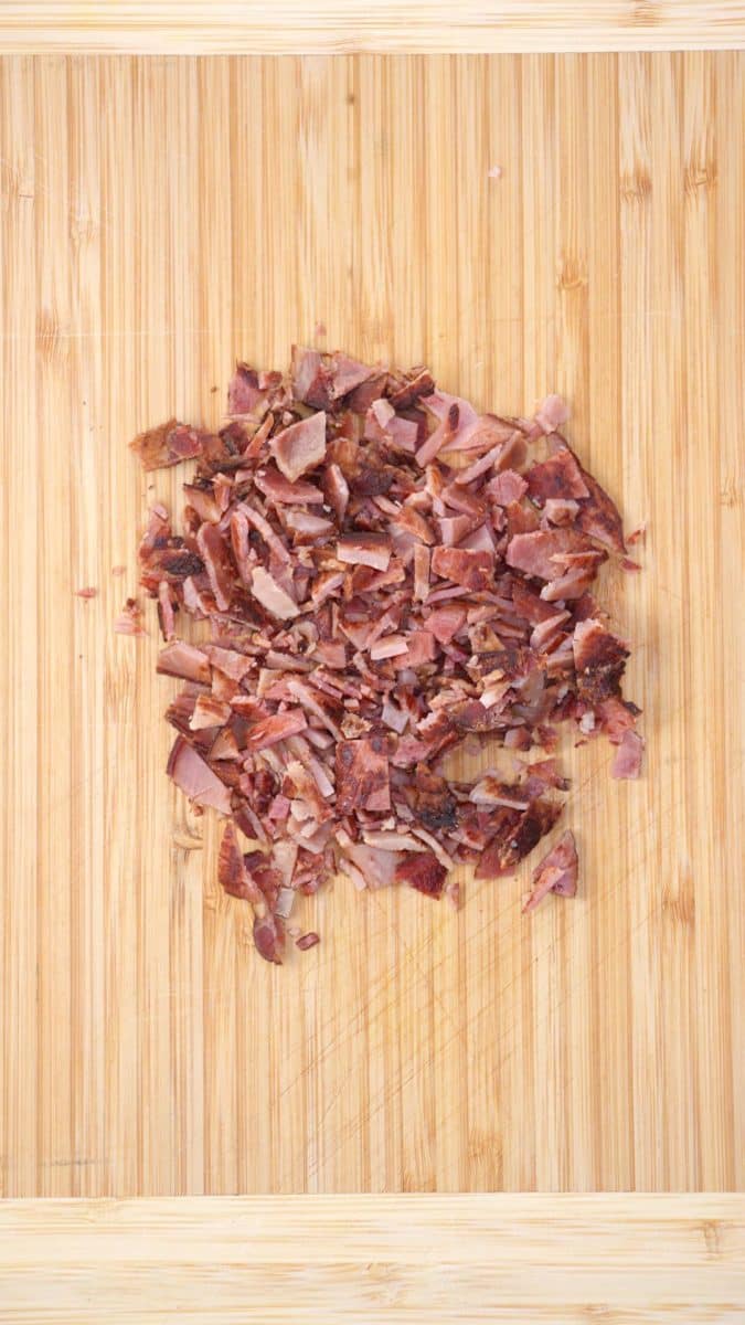 Chopped Canadian bacon on a cutting board. Hostess At Heart