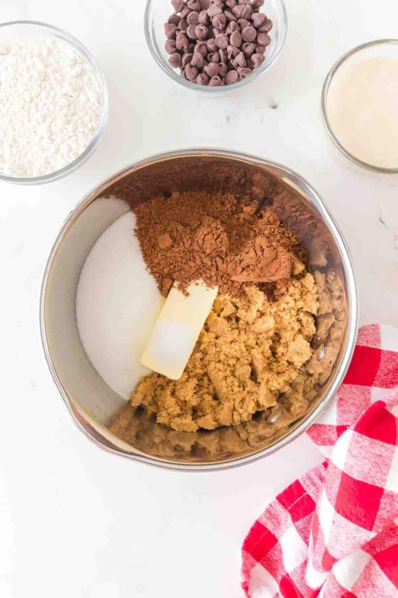 A saucepan containing white and brown sugar, unsweetened cocoa, and butter for melting. Hostess At Heart