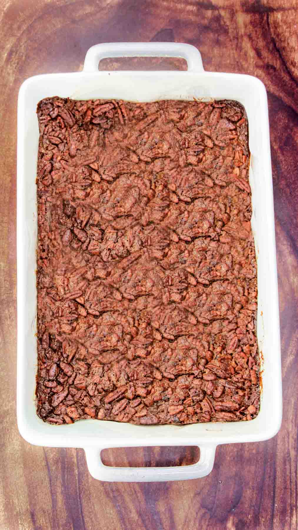 Top down view of a freshly baked pan of Derby Pecan Pie Brownies pulled from the oven. Hostess At Heart