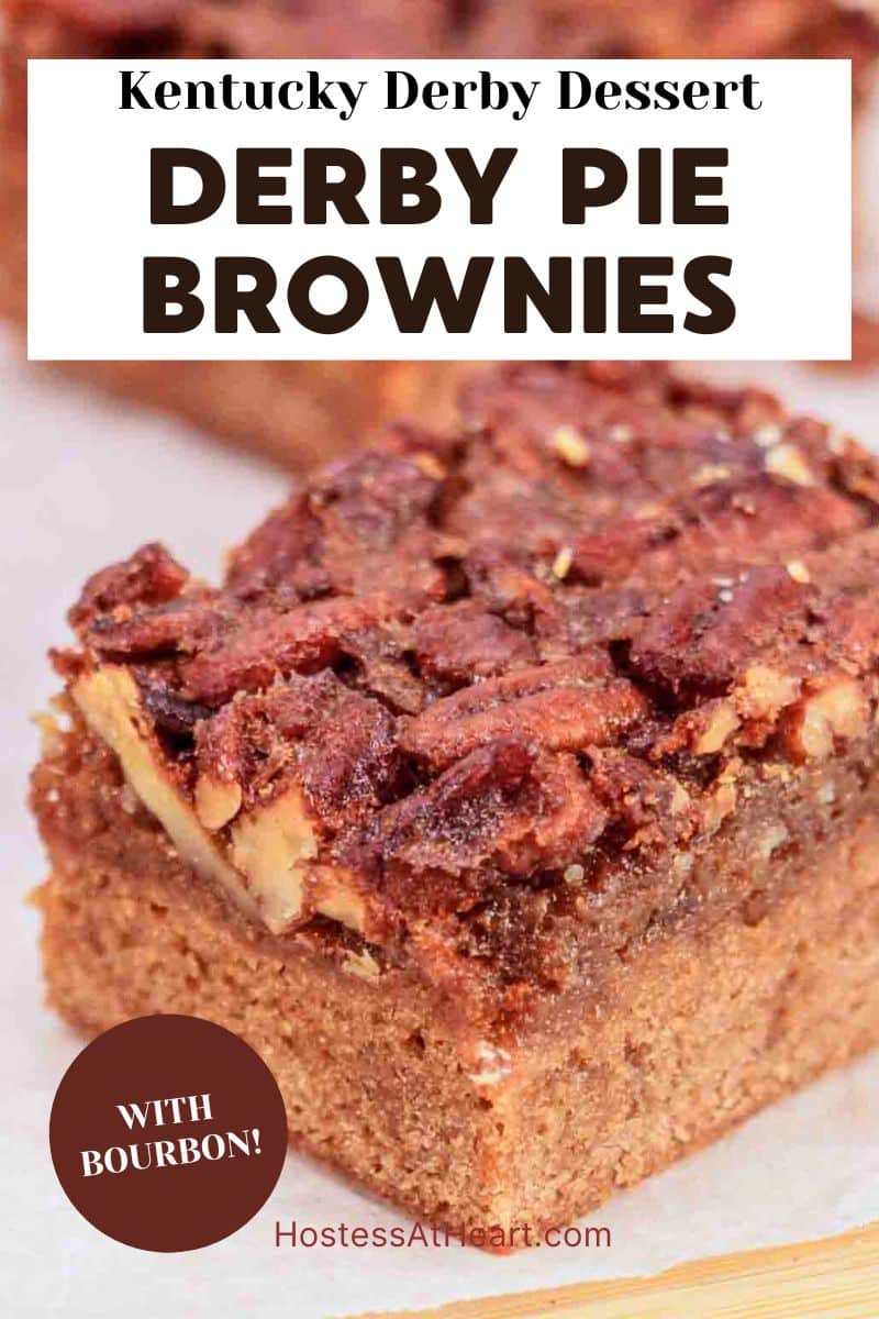 An image for Pinterest of a piece of Kentucky Derby Pie Brownie showing pecan topping layer on parchment paper - Hostess At Heart