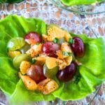 An easy grape salad with clementines on a butter lettuce leaf, drizzled with poppyseed dressing. Hostess At Heart