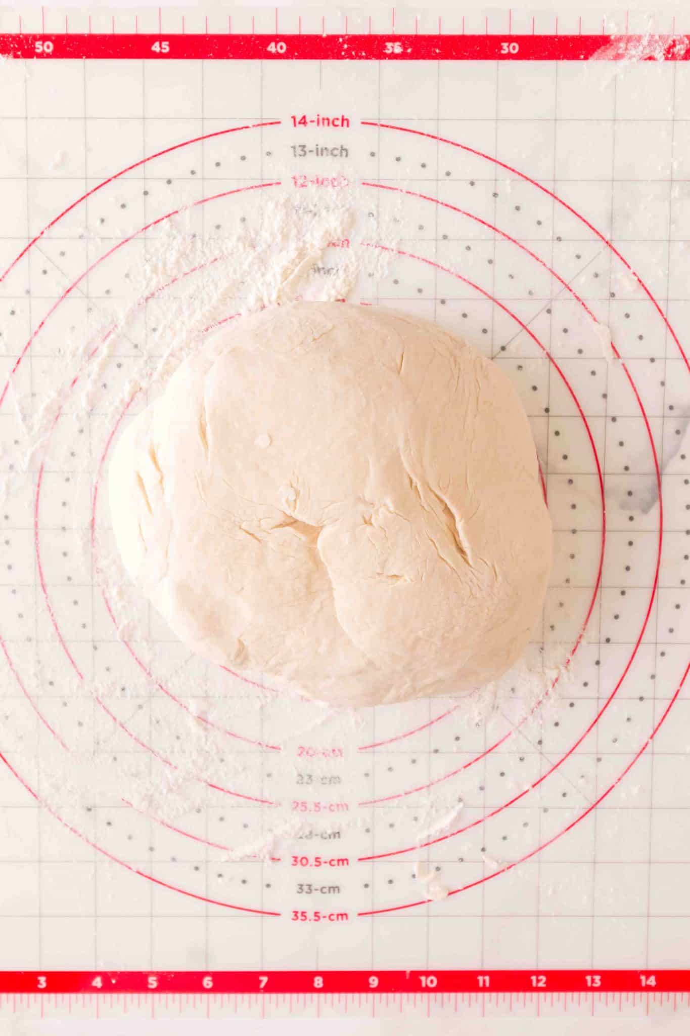 Freshly shaped dough on a pastry mat ready to rise in a bowl. Hostess At Heart