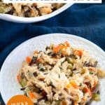 A white plate filled with shredded chicken, wild rice, colorful veggies that were made in an instant pot - Hostess At Heart