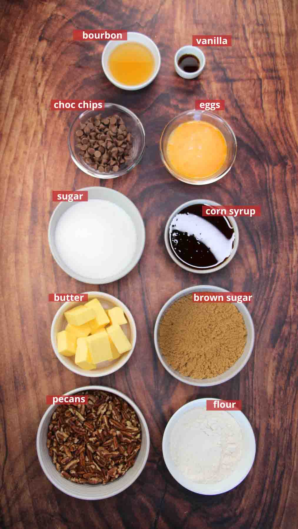Ingredients used to make Derby Pie Brownies: flour, sugar, chocolate chips, butter, eggs, corn syrup, bourbon, vanilla, and pecans - Hostess At Heart