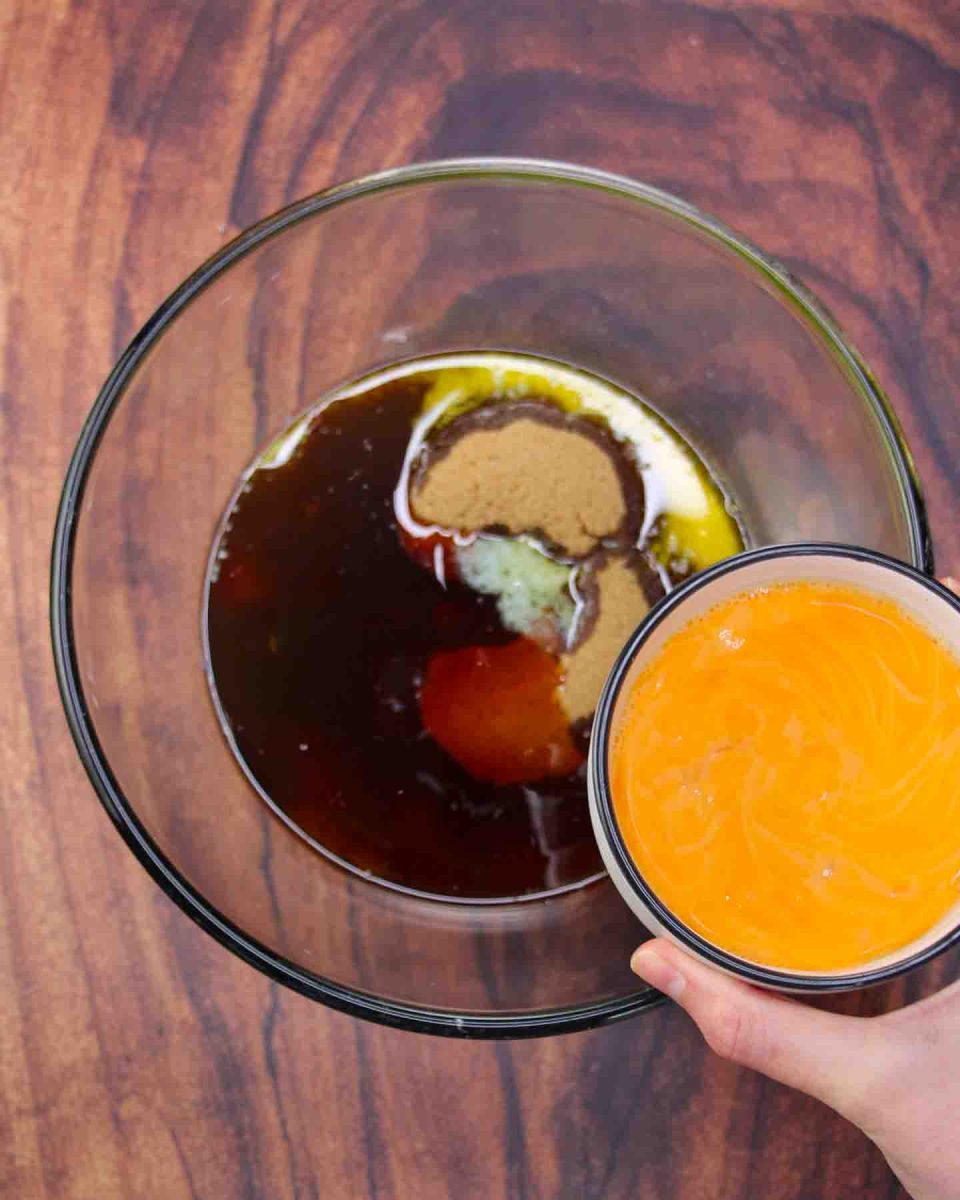 Eggs added to pecan pie ingredients in a mixing bowl - Hostess At Heart